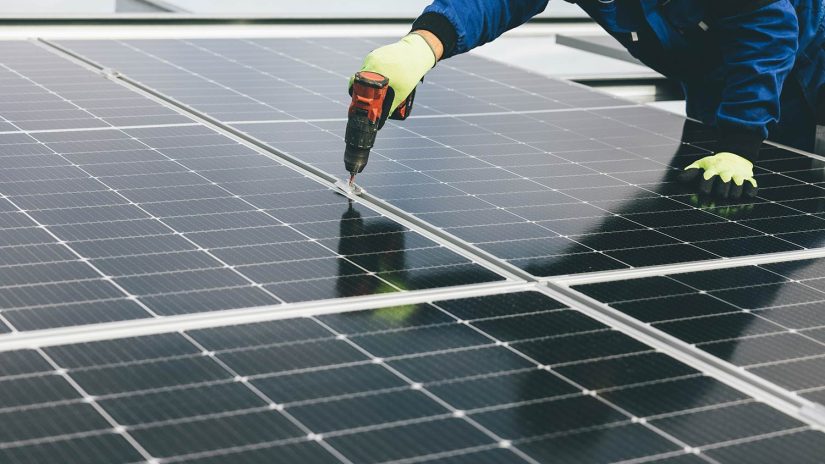 Commercial Solar Solution for Business Commercial solar panels being installed - AES