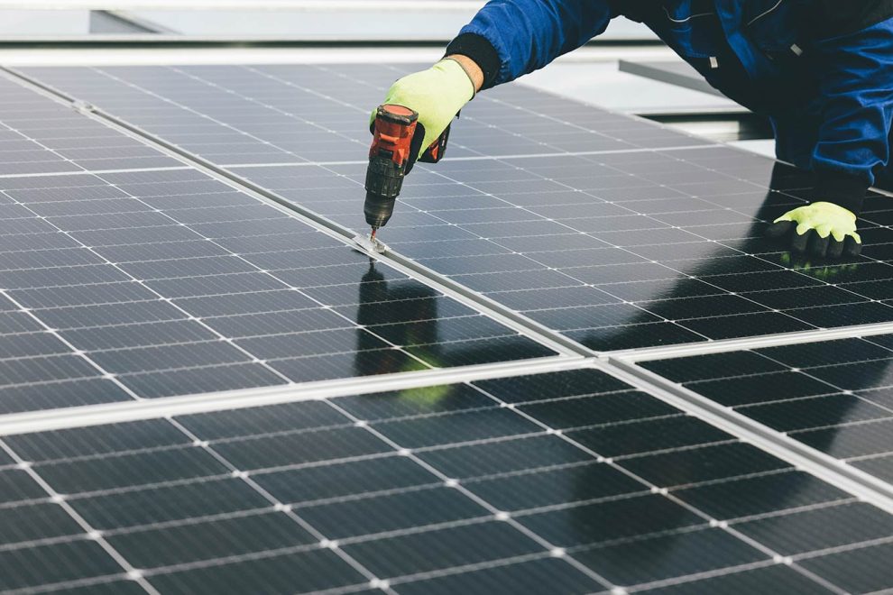 Commercial solar panels being installed - AES