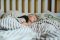 child sleeping in room with AC
