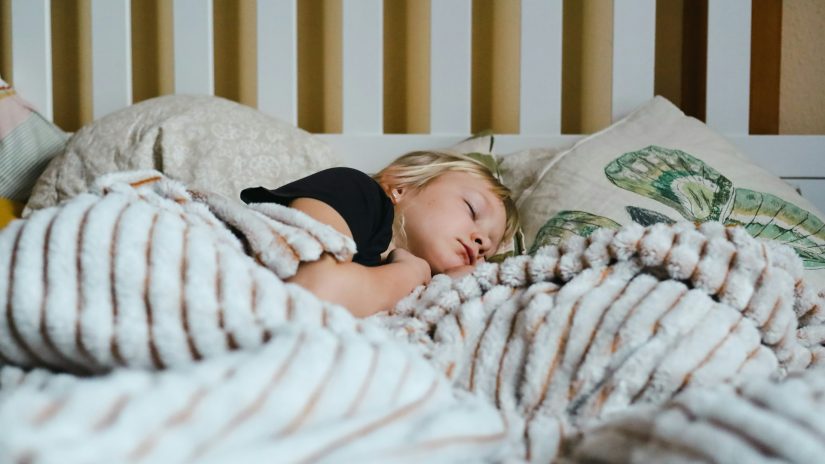 child sleeping in room with AC