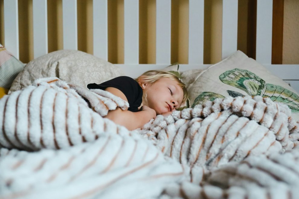 child sleeping in room with AC